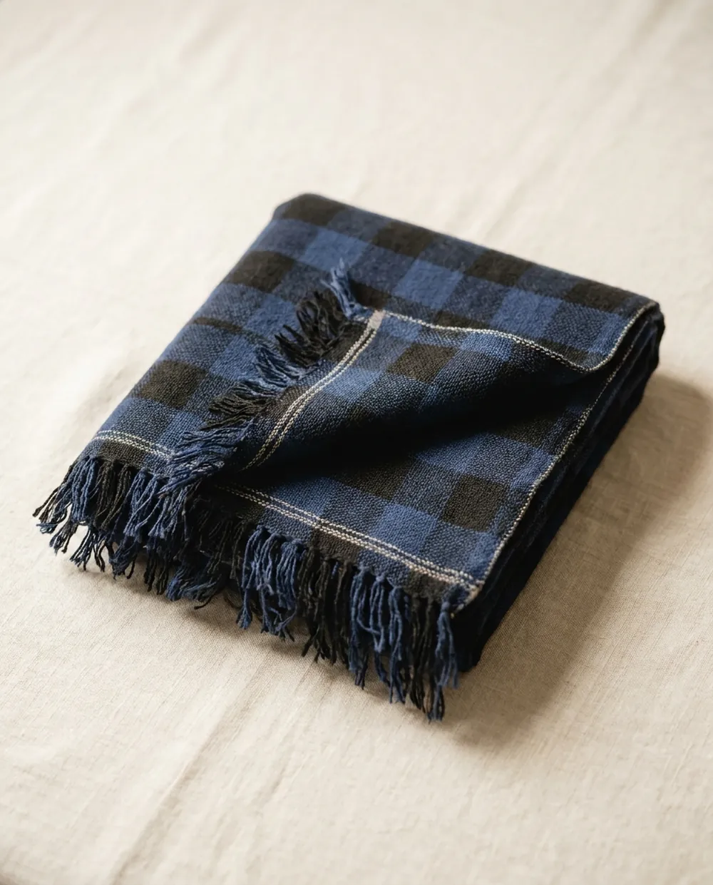 Folded navy and charcoal checked Maasai shuka